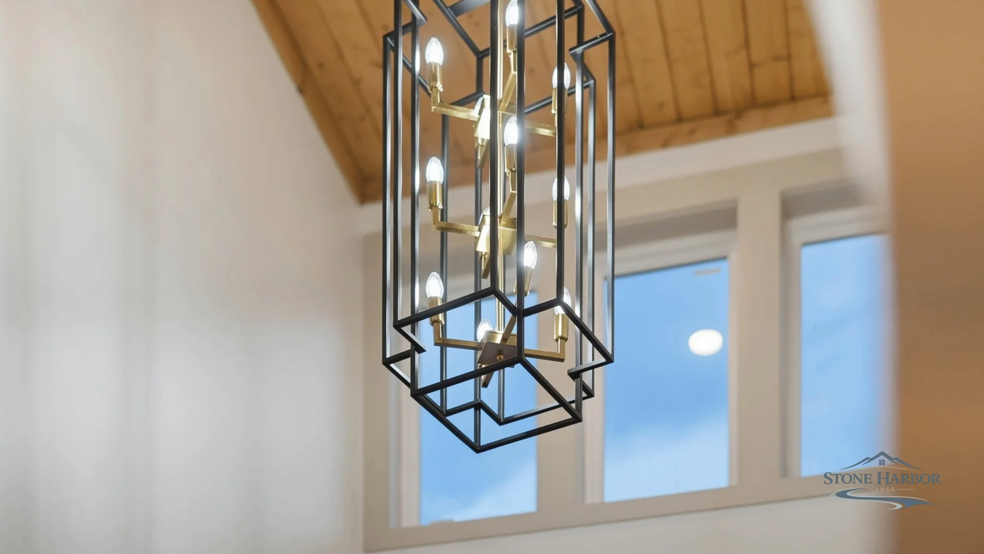 Green Pond vaulted ceiling with wood beams and chandelier
