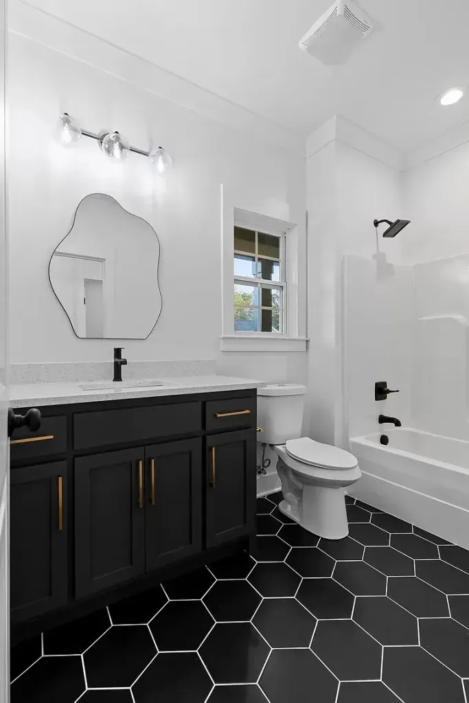 Double vanity with tall oval mirrors