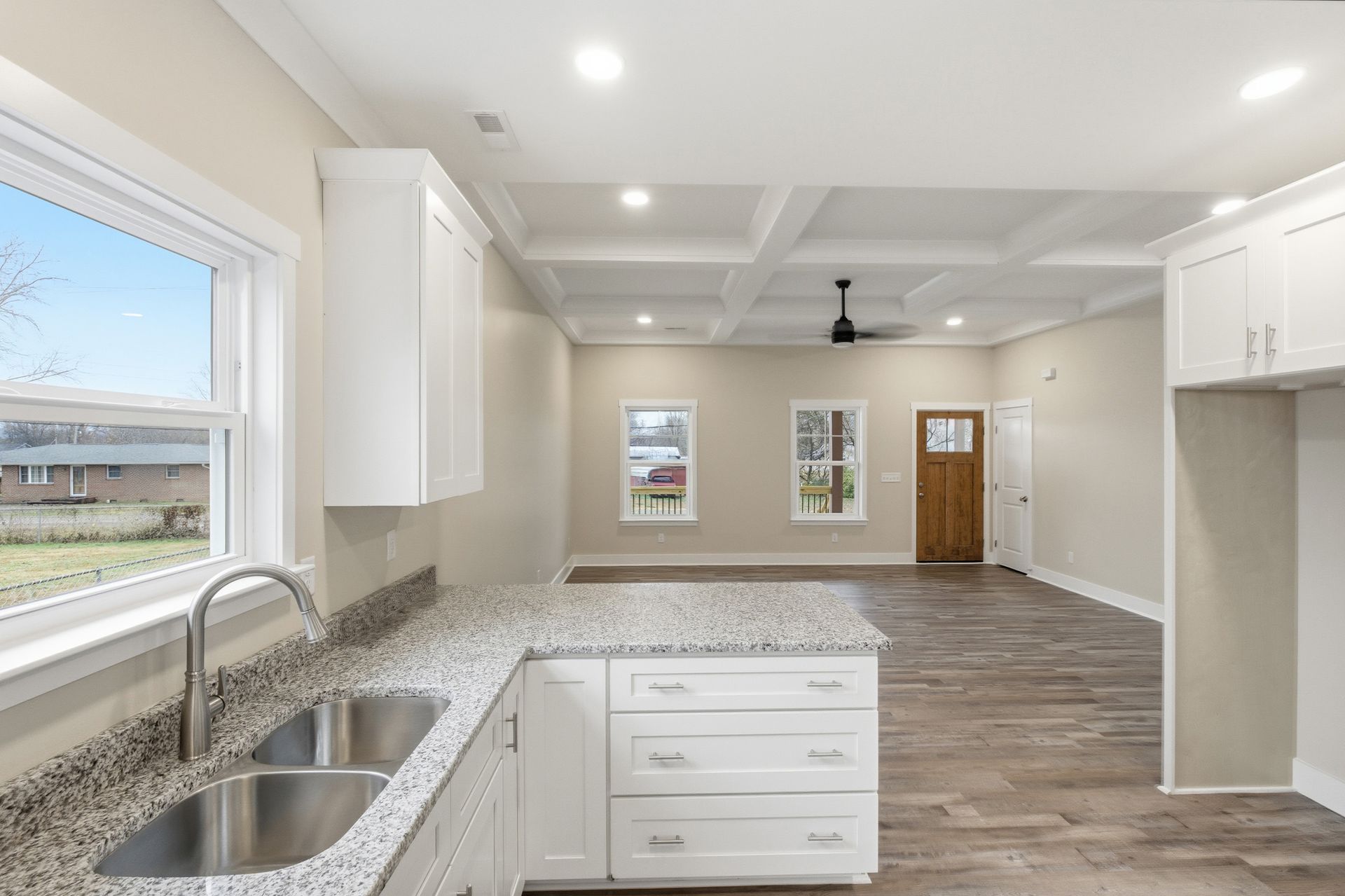 320 12th Ave kitchen with granite and white shaker cabinets